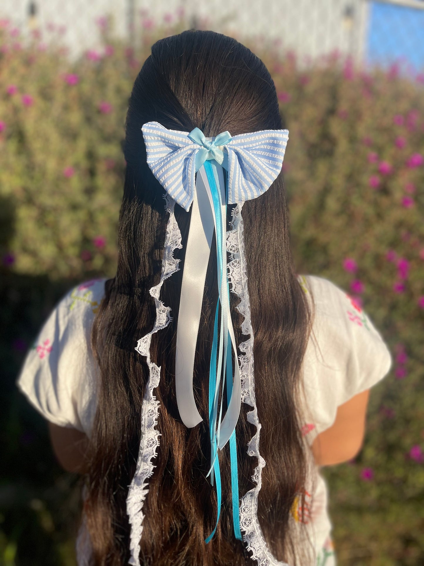 Stripped blue and white bow